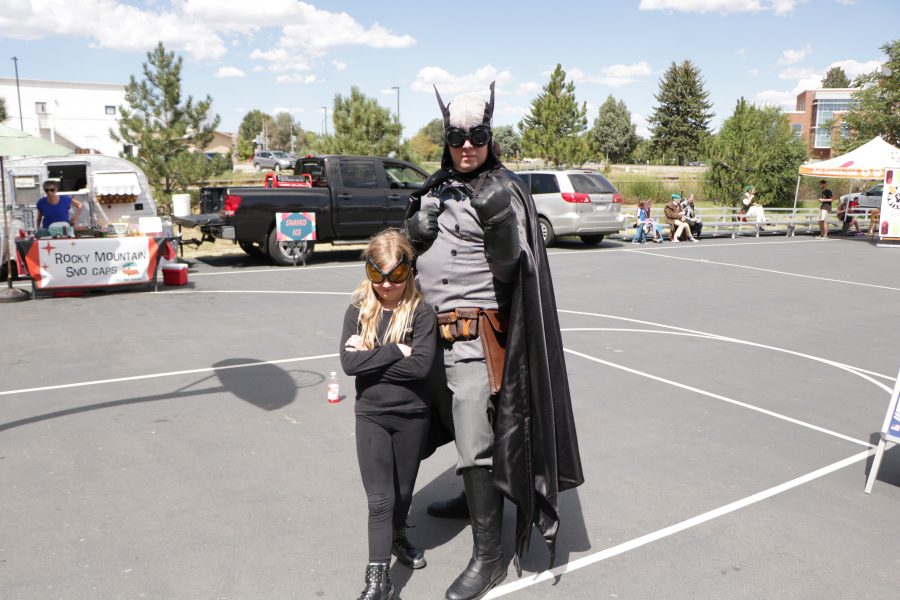 Chase and Zelia Stillson pose as Batman and Catwoman outside of the Fort Collins Comic Con. (Devin Cornelius | Collegian)