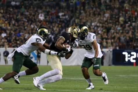 Kevin Nutt Jr. (left) and Justin Sweet (right) come together to make a tackle during the Rocky Mountain Showdown on September 1, 2017 (Jack Stakebaum | Collegian).