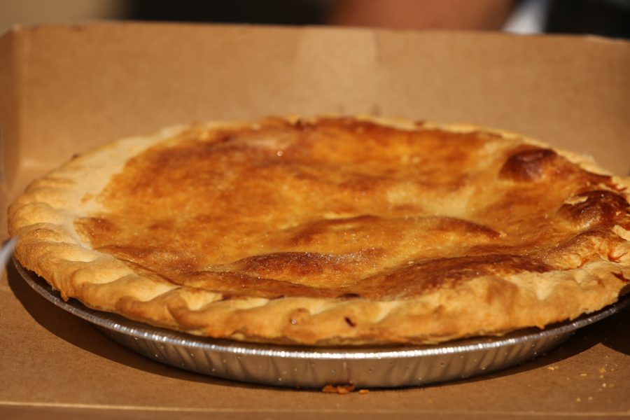 A peach pie sits on a table before the peach pie eating contest at the 2018 Fort Collins Peach Festival on Aug. 18.  (Forrest Czarnecki | The Collegian)