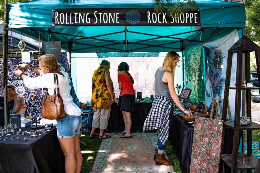 Patrons shop at the Rolling Stone Rock Shoppe during the Pagan Pride Day Festival on Aug. 25, in Fort Collins, Colorado. (Sara Graydon | Collegian)