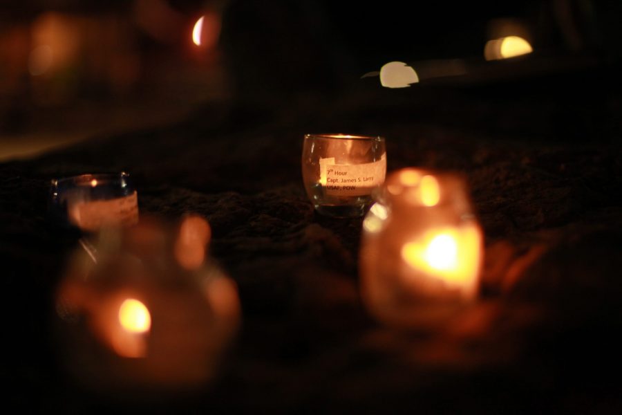 Candles labeled with the names of previous prisoners-of-war were lit every hour and the poem Come for Me by LeAnn Thieman was read. (Natalie Dyer | Collegian)