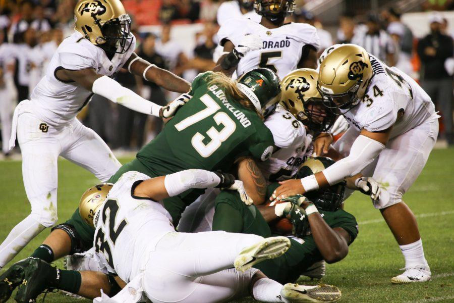 CSU football players are dogpiled during the Rocky Mountain Showdown. The Rams lost to the Buffs  13-45. (Collegian file photo)