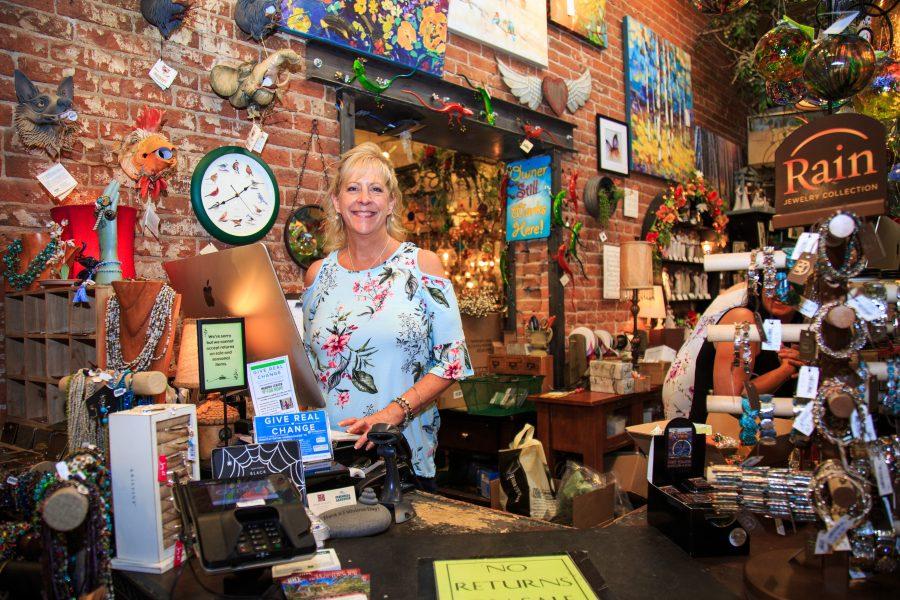 Ellen Zibell, co-owner and co-founder of The Perennial Gardener, stands behind the counter. Zibell and her husband founded the shop for, garden and nature inspired gifts 23 years ago in Old Town because they did not want to be located within a mall. (Davis Bonner | Collegian)