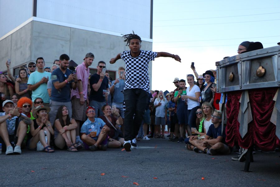 A member of the ArtsyFartsy collective does a fantastic flip for the camera and audience. (Devin Cornelius | Collegian)