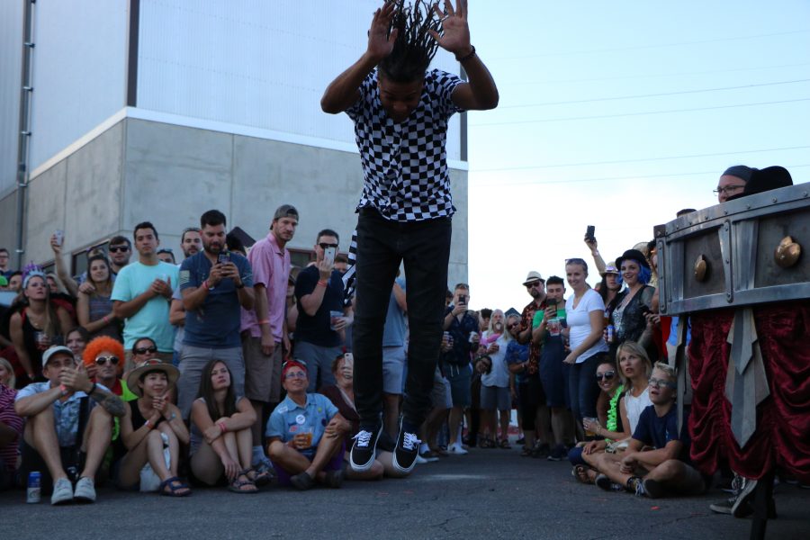 A member of the ArtsyFartsy collective does a fantastic flip for the camera and audience. (Devin Cornelius | Collegian)