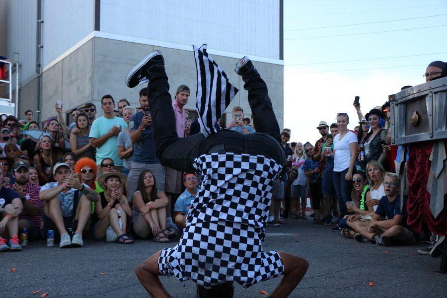 A member of the ArtsyFartsy collective does a fantastic flip for the camera and audience. (Devin Cornelius | Collegian)