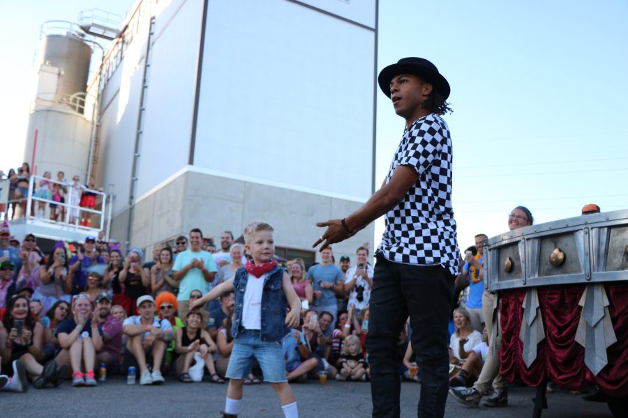 A member of the ArtsyFartsy collective speaks to the audience while performing (Devin Cornelius | Collegian)