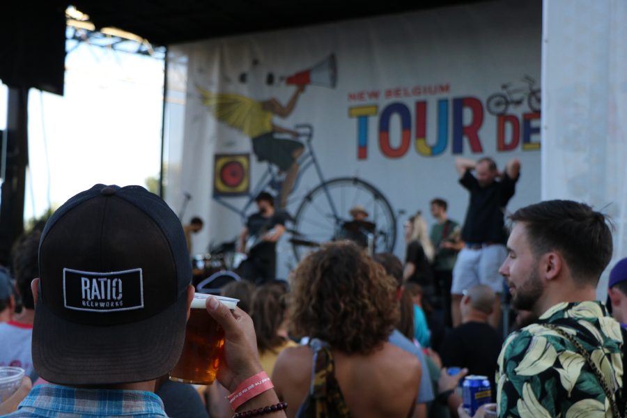 A man watches Phosphoresent the headliner for Tour De Fat perform. (Devin Cornelius |  Collegian)