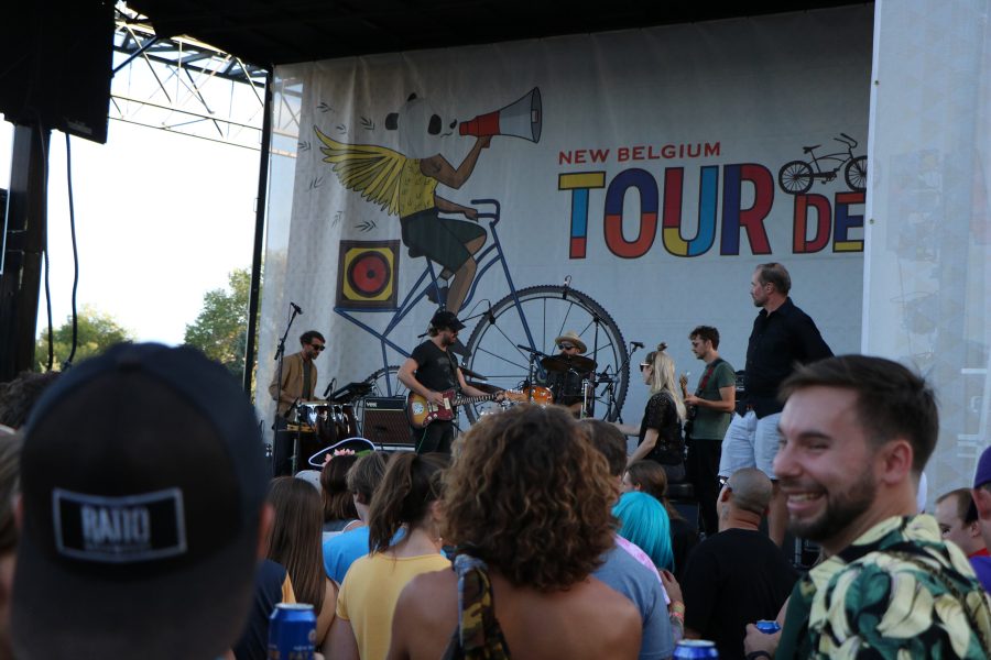 A man watches Phosphoresent the headliner for Tour De Fat perform. (Devin Cornelius |  Collegian)
