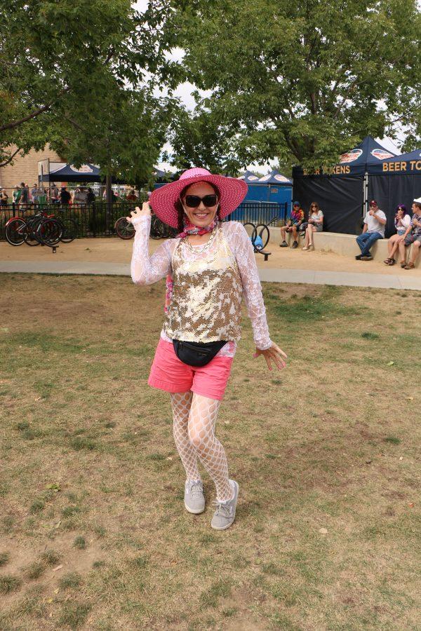 Linda Rohlfs srikes a pose for the camera as she dances at the New Belgium Tour De Fat Concert. (Devin Cornelius | Collegian)