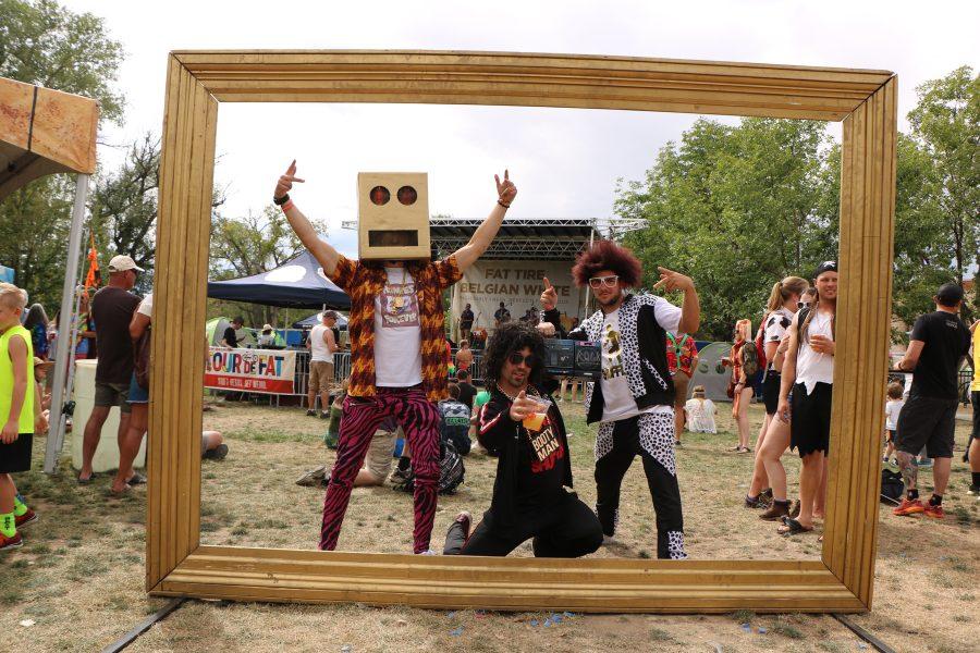 Nick Kaufhold, Sam Wright, and Jeremy Dover pose while dressed as LMFAO at the Tour De Fat Concert. (Devin Cornelius | Collegian)
