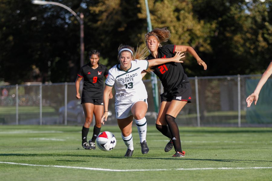 Caeley Lordemann pushes past an Eastern Washington player and chases down the ball. (Ashley Potts | Collegian)