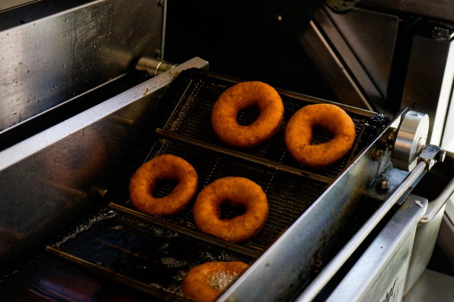 Friend goodness rises out of the 'donut robot.' Barghols fries all the donuts in an organic Colorado sunflower oil. (Lauryn Bolz | The Collegian)