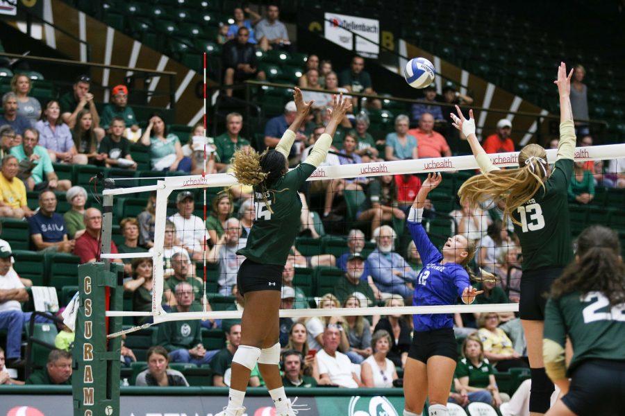 Breana Runnels (#15) and Kirstie Hillyer (#13) jump up to block the ball (Devin Cornelius | Collegian)