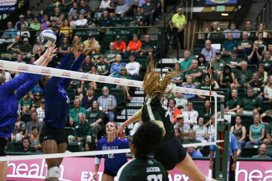 A CSU player spikes the ball down on the ISU defense (Devin Cornelius | Collegian)