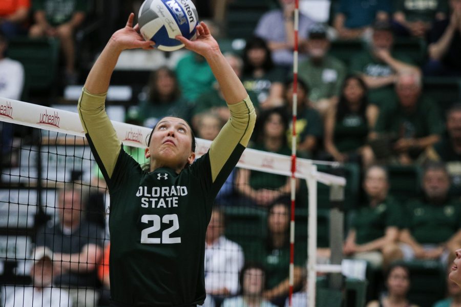 Setter Katie Oleksak (#22) leaps to set the ball for CSU (Devin Cornelius | Collegian)
