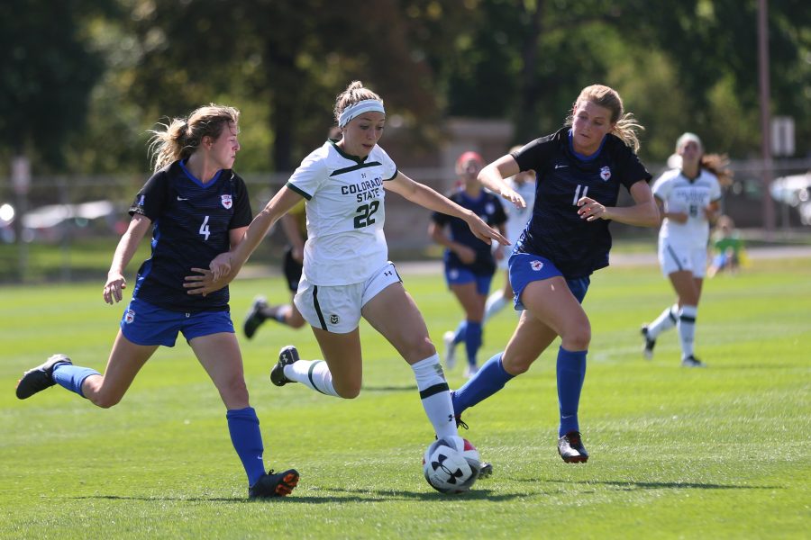 Sophomore Midfielder Karli Eheart moved the ball down the field past SMU Defender Haley Thompson (11) and Midfielder Hailey Bishop (4) during the second half of play on September 16, 2018 at the Rams Soccer Complex. (Elliott Jerge | Collegian)