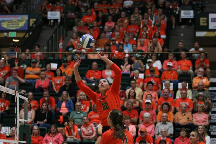 Katie Oleksak jump sets the ball for her team (Devin Cornelius | Collegian)