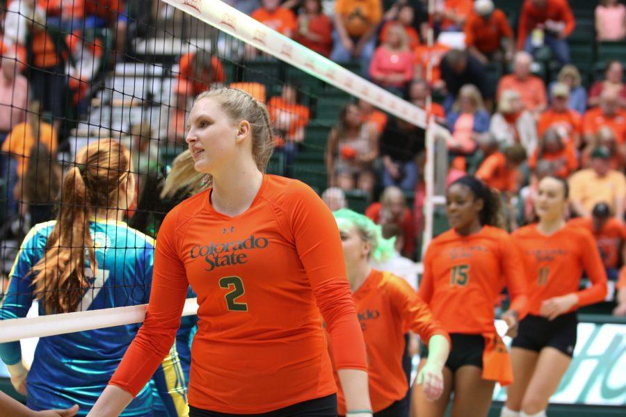 Ellie Gubser leads her team on to the court to shake hands with the San Jose State team. (Devin Cornelius | Collegian)