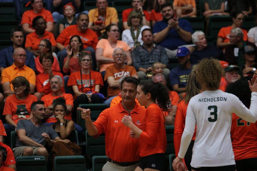 Tom Hilbert coaches Katie Oleksak during the game against Jose State. (Devin Cornelius | Collegian)