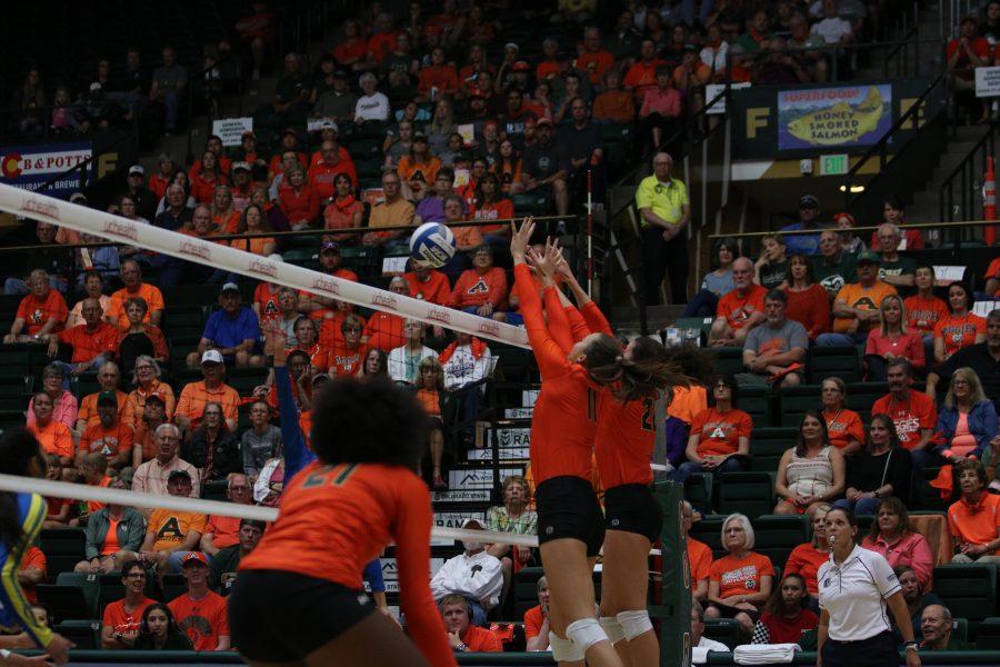 Paulina Hougaard-Jensen and Katie Oleksak jump to bat the ball down (Devin Cornelius | Collegian)