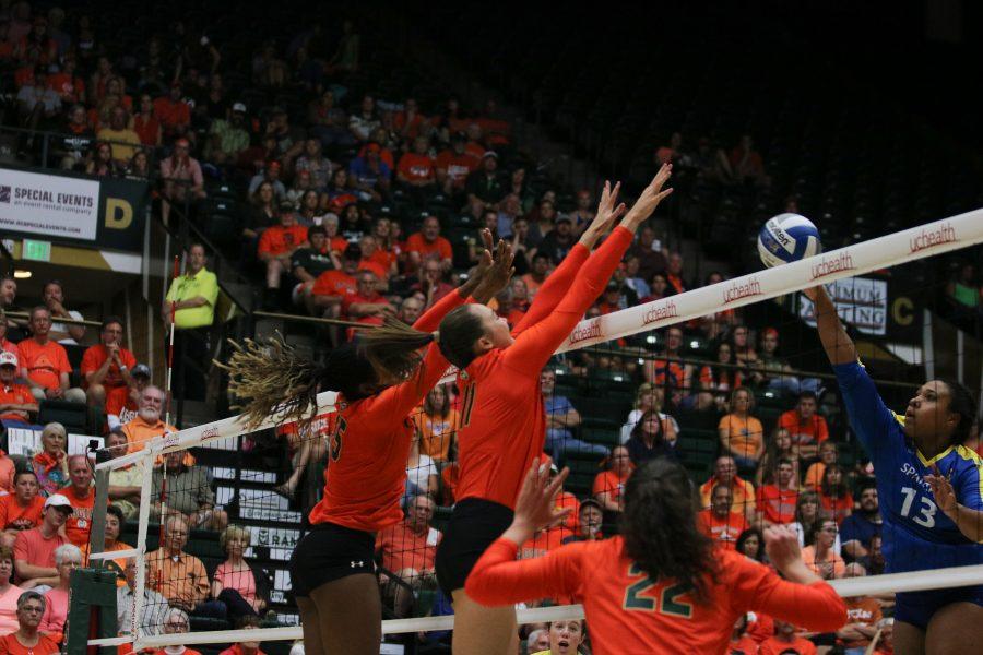 Breana Runnels (15) and Paulina Hougaard-Jensen (11) leap to stop the ball (Devin Cornelius | Collegian)