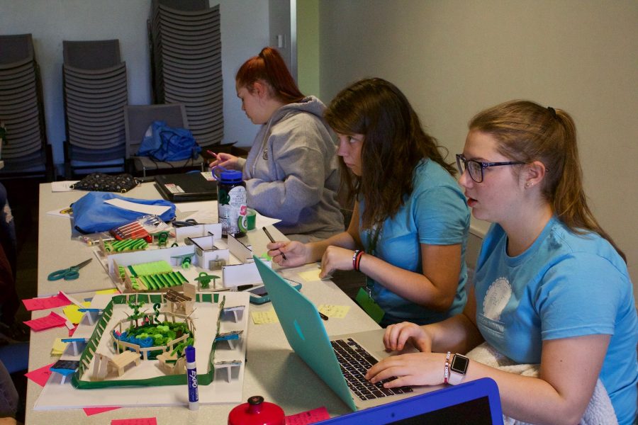 College and high school students working at the All-Woman Innovation Marathon. The event was held at CSU on September 22nd and 23rd. Participants were assigned a project for their client, the City of Fort Collins, that supported the citys Climate Action Plan. (Abby Flitton | Collegian)