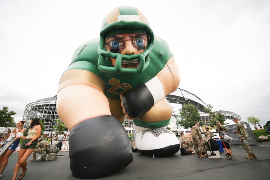 A giant inflatable CSU football player is strung up next to the CSU Alumni Association before the Rocky Mountain Showdown. (Tony Villalobos May | Collegian)