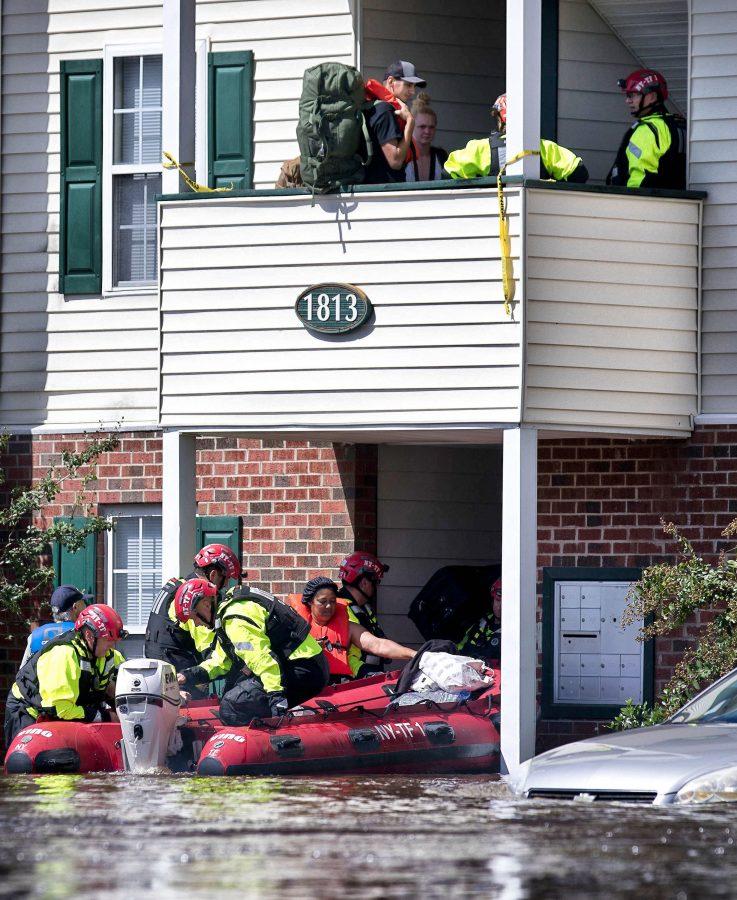 New York Urban Search and Rescue team members check for residents at the Heritage at Fort Bragg Apartments in Spring Lake, N.C., Tuesday Sept. 18, 2018. (Julia Wall/Raleigh News & Observer/TNS)