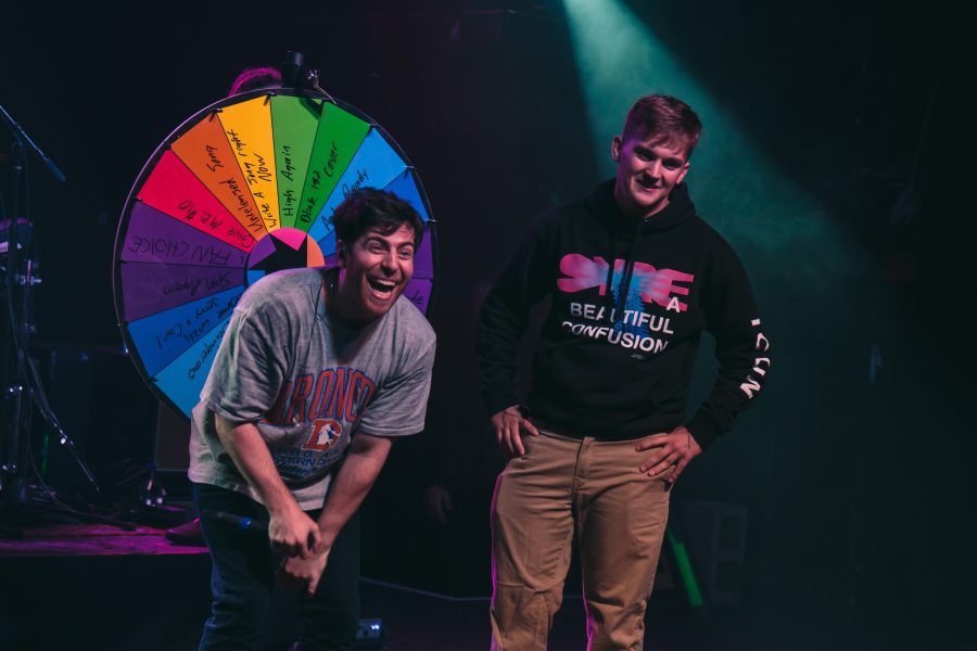 An audience joins Hoodie Allen on stage to spin the prize wheel during his performance at the Aggie Theater on Friday. (Davis Bonner | Collegian)