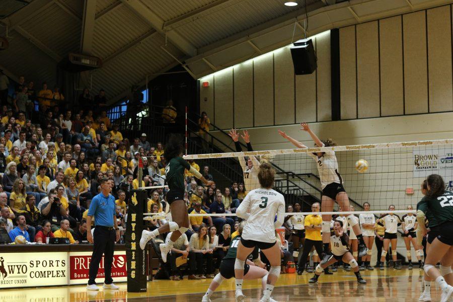 Breana Runnels spikes the ball down on the Wyoming defense(Devin Cornelius | Collegian)