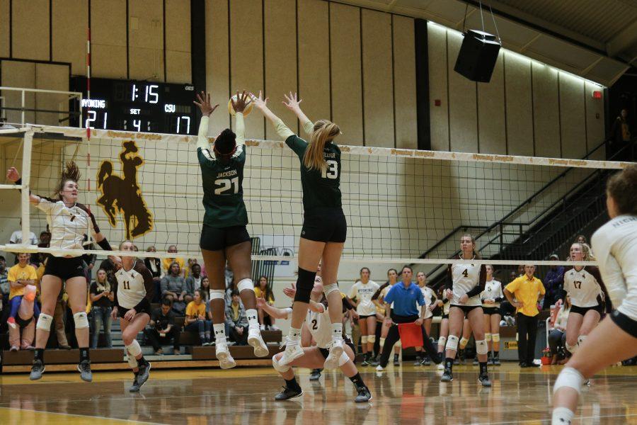 Jessica Jackson and Kristie Hillyer bat the ball back down onto the Wyoming side (Devin Cornelius | Collegian)