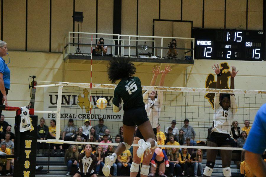 BReana Runnels spikes the ball down on a Wyoming player (Devin Cornelius | Collegian)