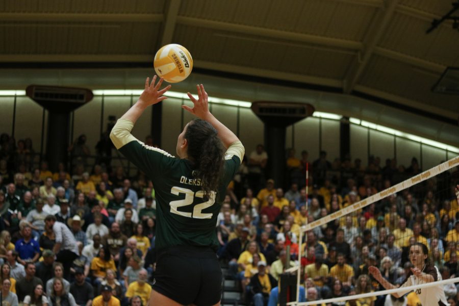 Katie Oleksak sets the ball to Breana Runnels during their game against Wyoming (Devin Cornelius | Collegain)