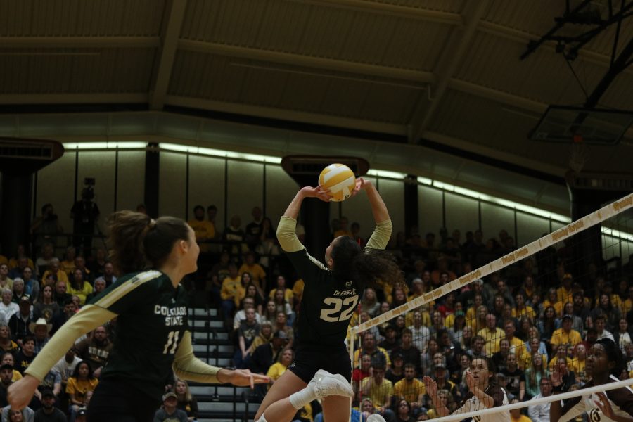Katie Oleksak jump sets Paulina Houggard-Jensen  during their game against Wyoming (Devin Cornelius | Collegain)
