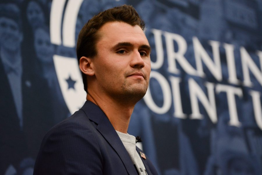 Candace Owens listens as Charlie Kirk speaks on Oct 3 during their first stop on their Campus Clash tour. (Colin Shepherd | Collegian)