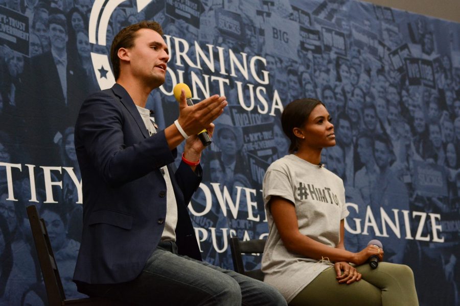 Charlie Kirk and Candace Owens speak to audience members on Oct 3. Kirk and Owens are on their first stop of their Campus Clash tour. (Colin Shepherd | Collegian)