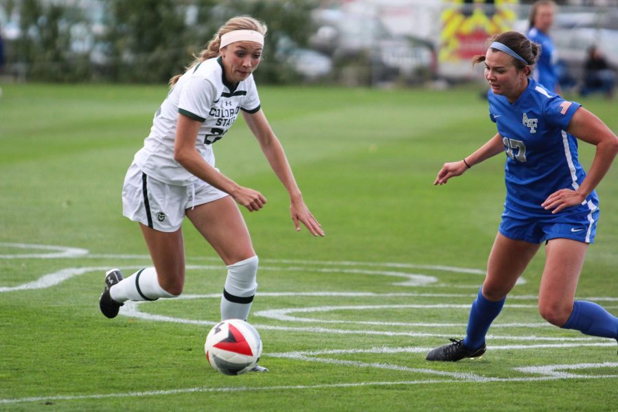 Karli Eheart, number 22, grabs the ball during the game against Air Force on Saturday, Oct. 5. (Clara Scholtz | Collegian)