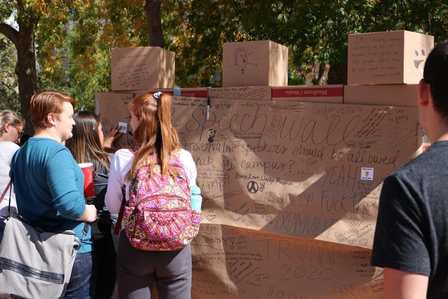 CSU students write on their thoughts onto the free speech wall in the LSC Plaza. (Devin Cornelius | Collegian)