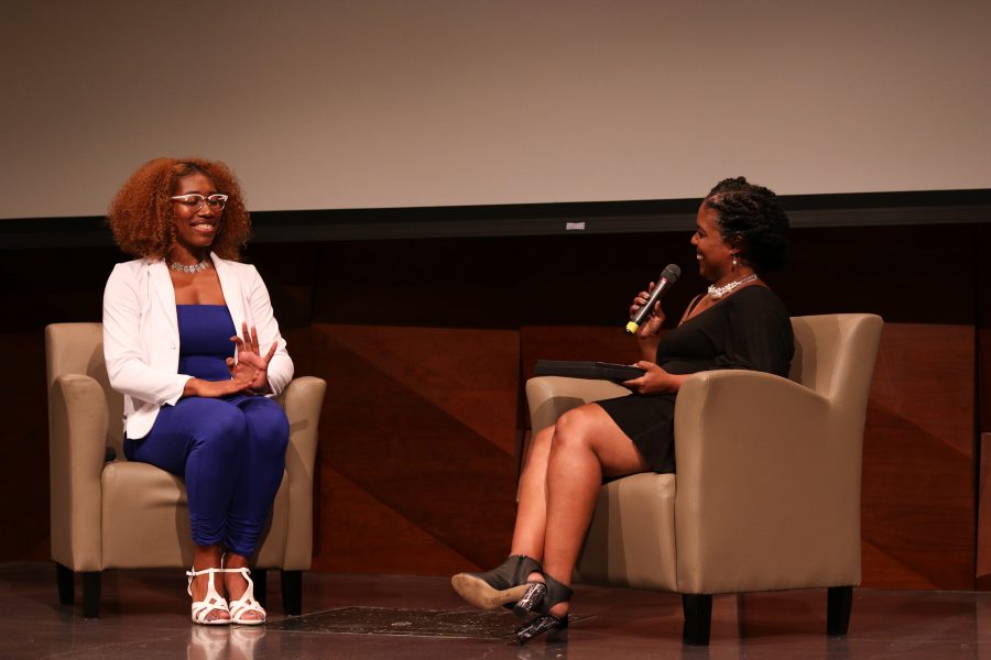 Kerrianaa Tatum laughs with Bridgette Johnson during the question section of the pageant. (Devin Cornelius | Collegian)