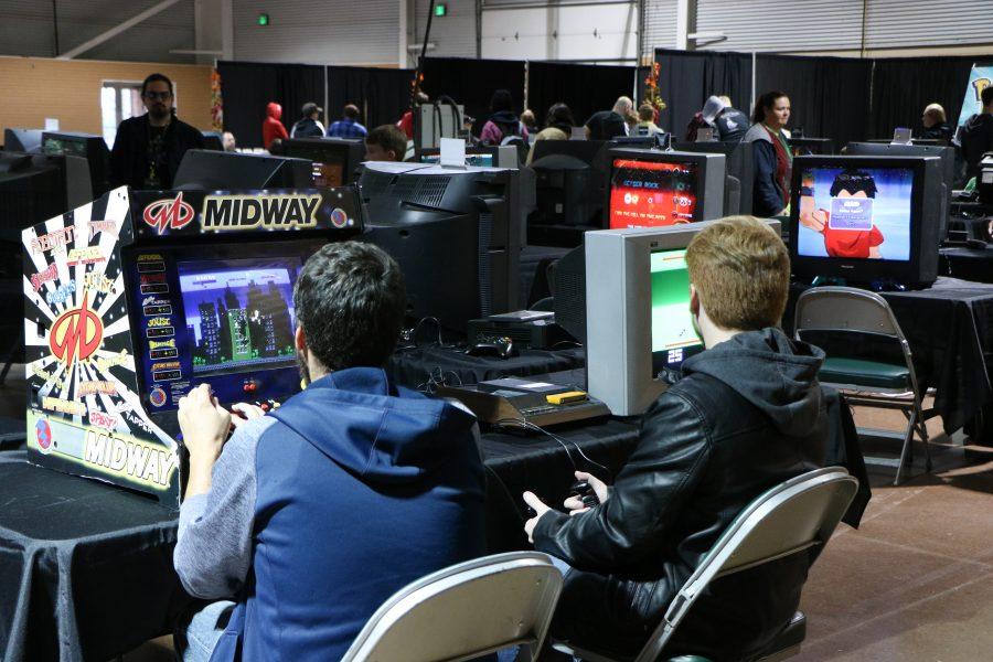 Jermey T Rader and Chester Johnson play some retro games at VinCon. (Devin Cornelius | Collegian)