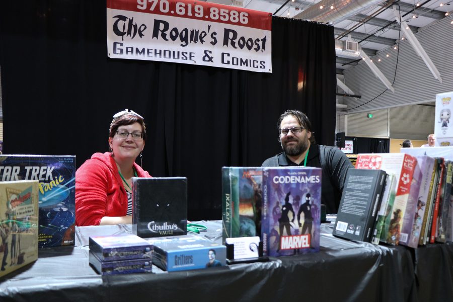Karolyn Murphy and William Magnuson smile as they sit in front of The Rogue's Roost Booth. (Devin Cornelius | Collegian)
