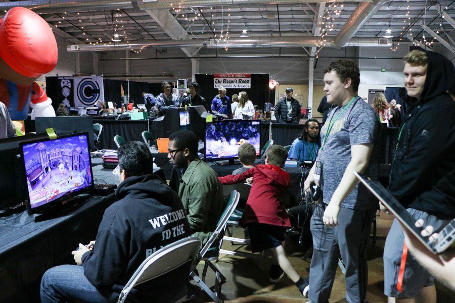 People watch as contenders battle in the preliminary rounds of the super smash bros tournament at VinCon (Devin Cornelius | Collegian)