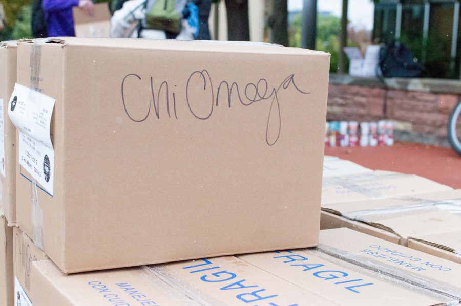 Boxes of cans collected by the Chi Omega sorority sit on the plaza during the CANstruction. (AJ Frankson | Collegian)