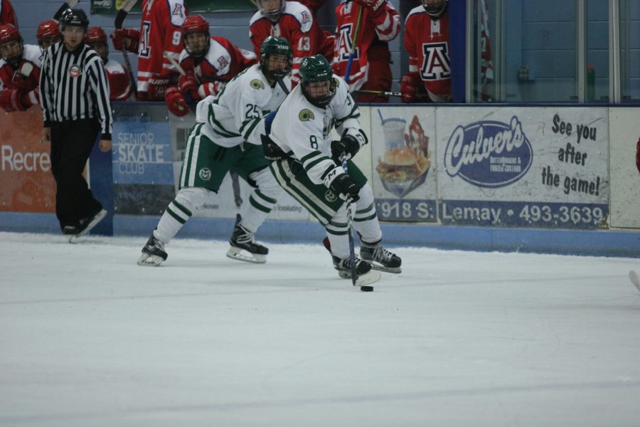 Sam Cote (8) and Tyler Hinchcliffe (25) take the puck down the ice towards the Arizona goal. (Devin Cornelius | Collegain)