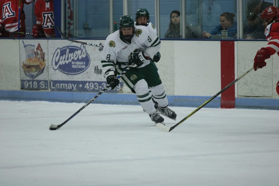 Sam Cote (8) heads down the ice towards the Arizona goal. (Devin Cornelius | Collegain)