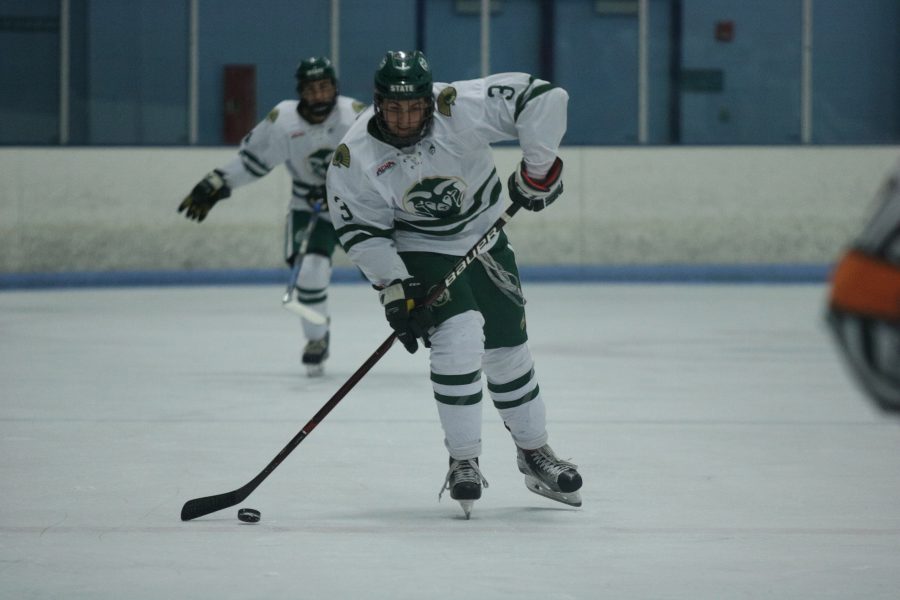 Jonathon Johnson (3) passes the puck to a teammate during their game against Arizona (Devin Cornelius | Collegian)