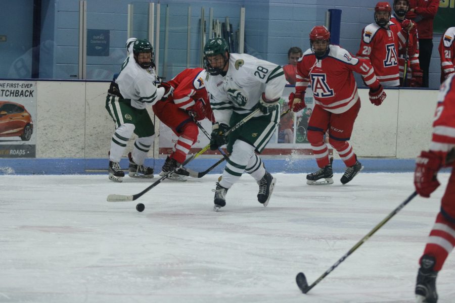 Kyle Reilly (28) takes the puck towards the Arizona goal. (Devin Cornelius | Collegian)