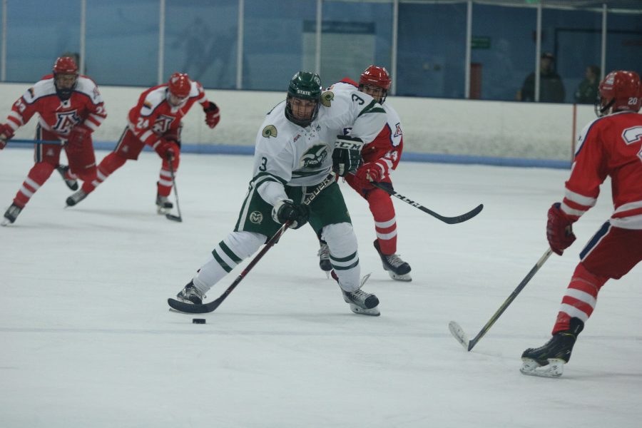 Jonathon Johnson (3) puts the puck into scoring position as he prepares to shoot. (Devin Cornelius | Collegian)