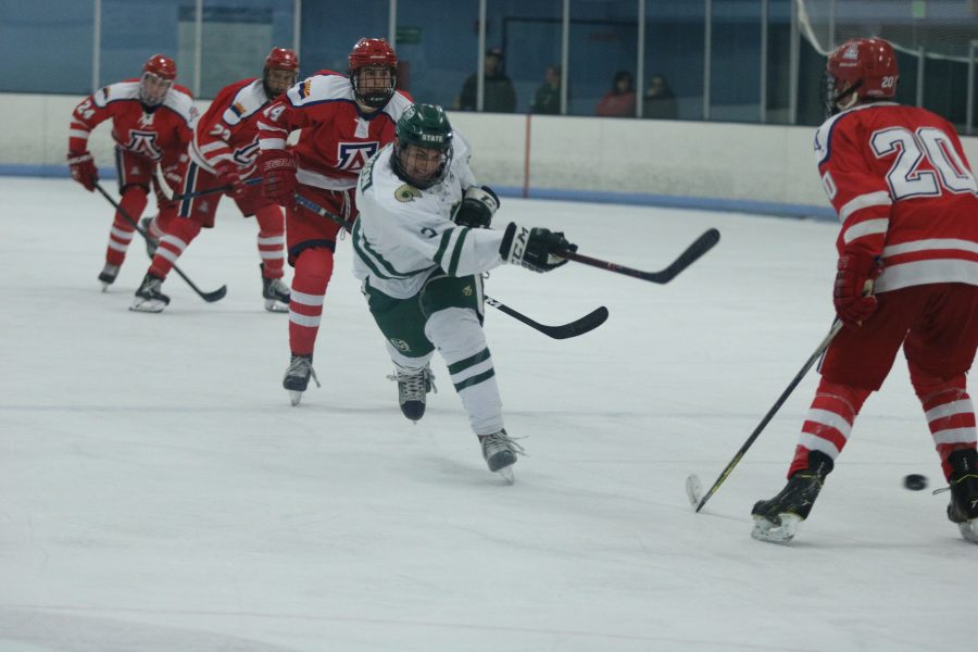 Jonathon Johnson (3) shoots the puck toward the Arizona goal. (Devin Cornelius | Collegian)